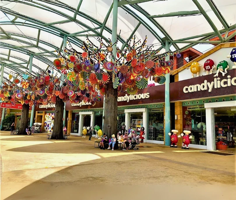 Decorative themed installation with colorful candy ornaments at Expo City Dubai, featuring fiberglass elements completed by our team.