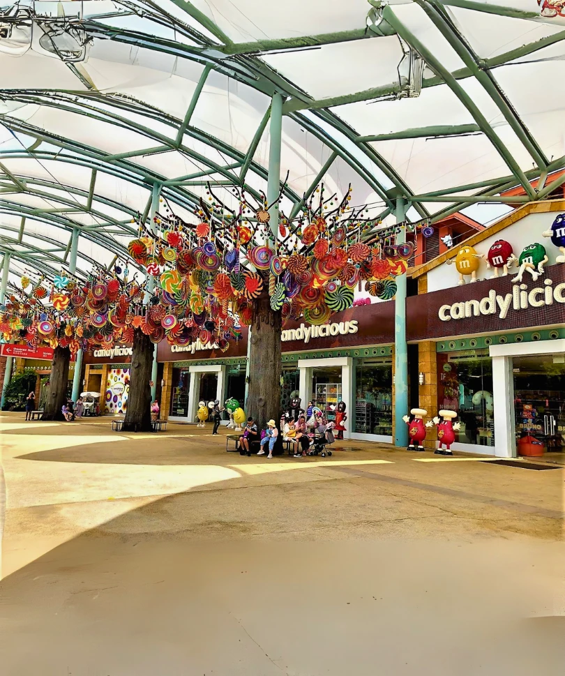 Decorative themed installation with colorful candy ornaments at Expo City Dubai, featuring fiberglass elements completed by our team.