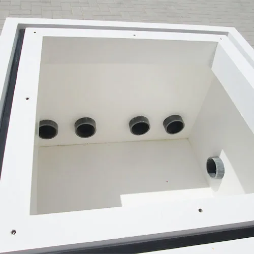 Inside view of GRP fiberglass tank with multiple pipe outlets